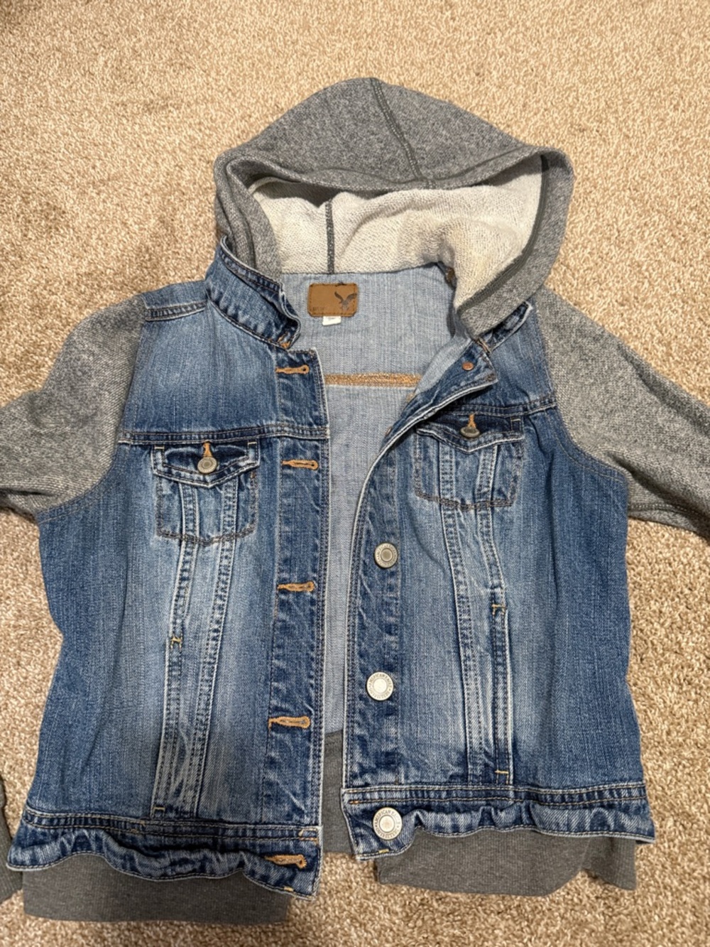 American eagle Jean jacket with gray sweatshirt style sleeves size medium